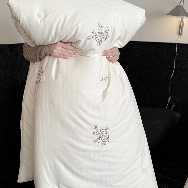 Quilted all-season duvet with floral embroidery and button detailing