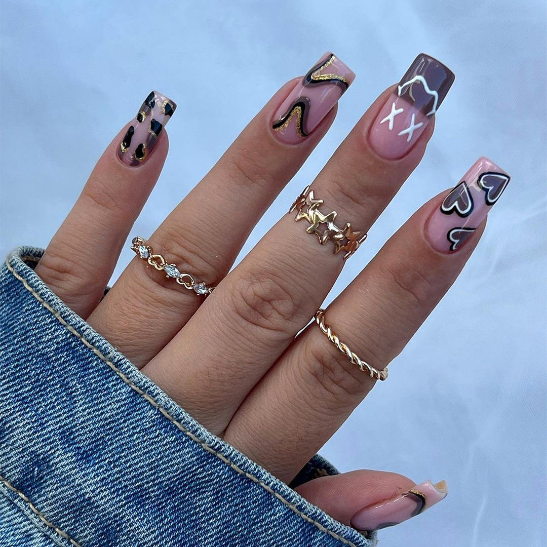 Artful nail extensions in elegant design with gold accents Kalsten