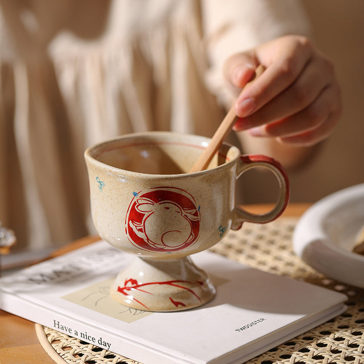 Ceramic foot mug with handle and hand-painted rabbit illustration