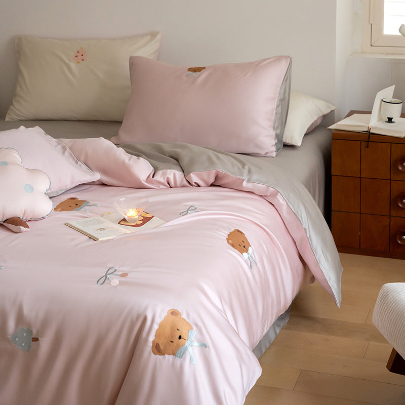 Luxurious satin bedding set with embroidered cherry motifs, reversible function and plush bunny pillow