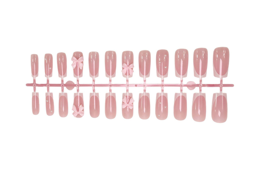 Nail art set with playful ribbon designs and elegant accents Kalsten