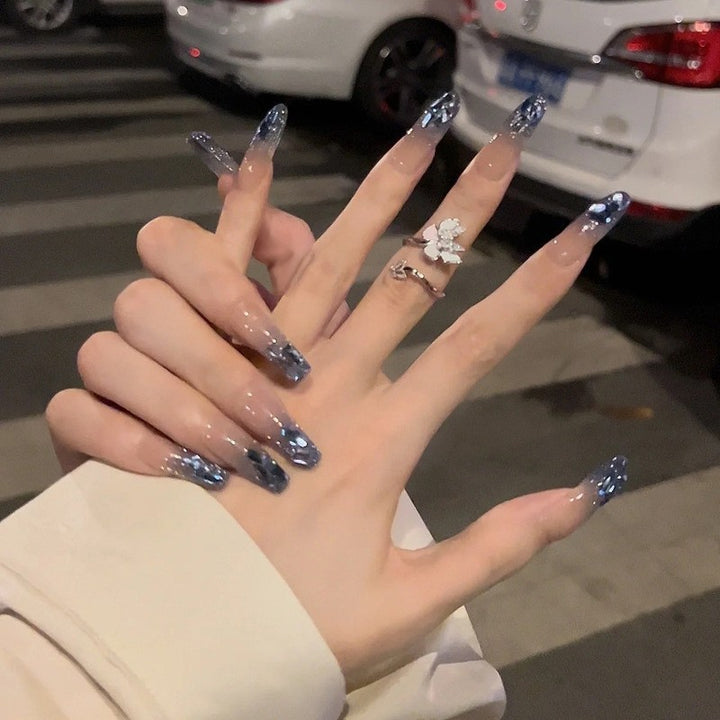 Glamorous artificial fingernails with glitter and moon designs Kalsten