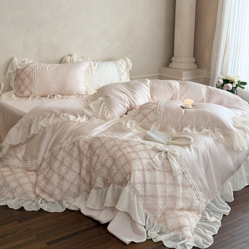 Romantic satin bedding set with ruffle, embroidered lace insert and bow appliqué