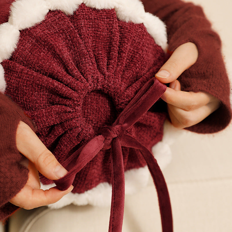Cylindrical lumbar and neck pillow with velvety chenille surface and crocheted trim Kalsten