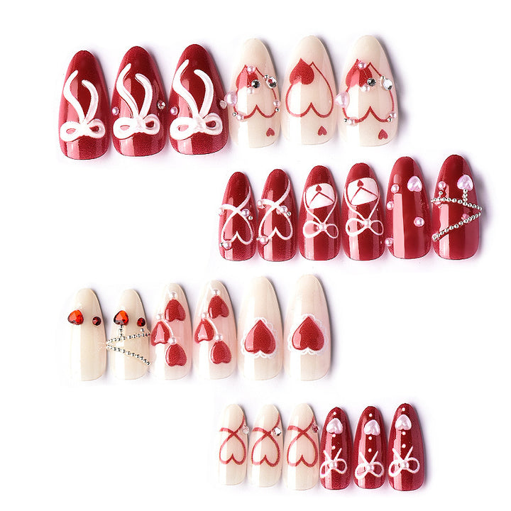 Glamorous artificial nail set with romantic heart design and elegant embellishments Kalsten