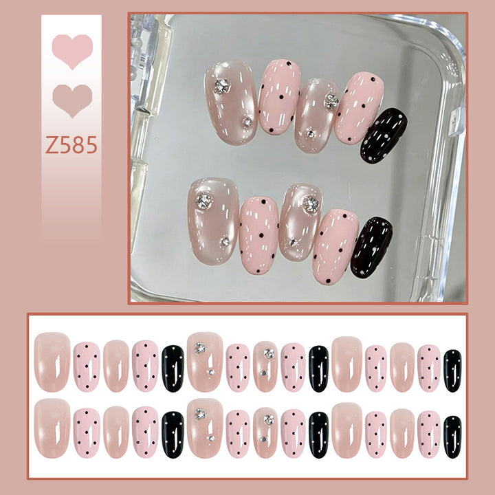 Acrylic nail set with glamorous rhinestone accents and modern dots Kalsten