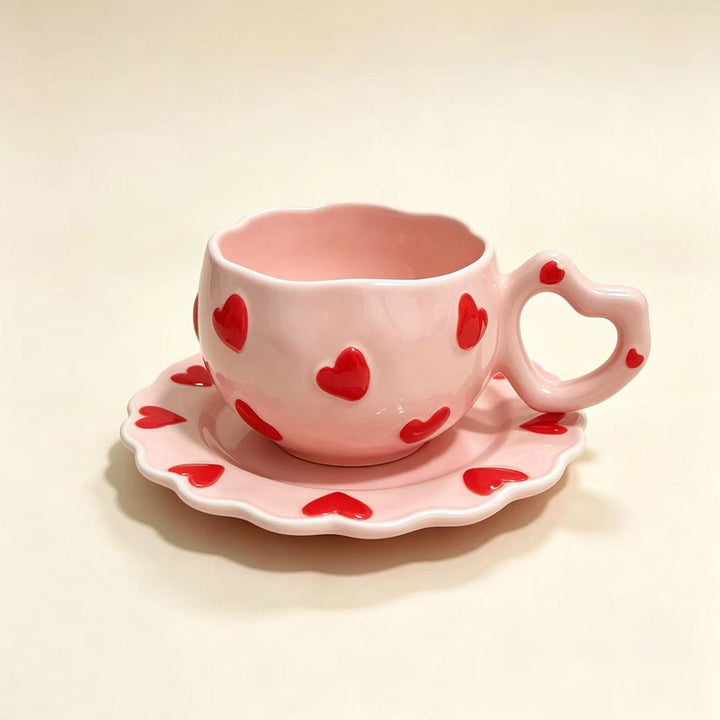 Porcelain cup set with heart-shaped handle and embossed decorative hearts