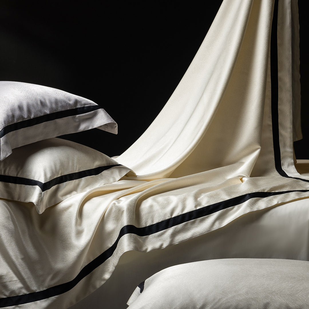 Luxurious satin bedding set with contrasting decorative trim