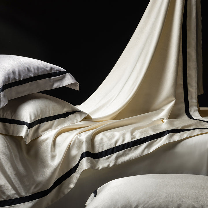 Luxurious satin bedding set with contrasting decorative trim