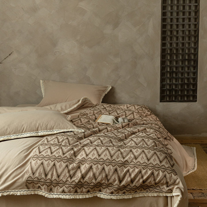 Premium cotton bedding set with woven ethnic overlay and fringes