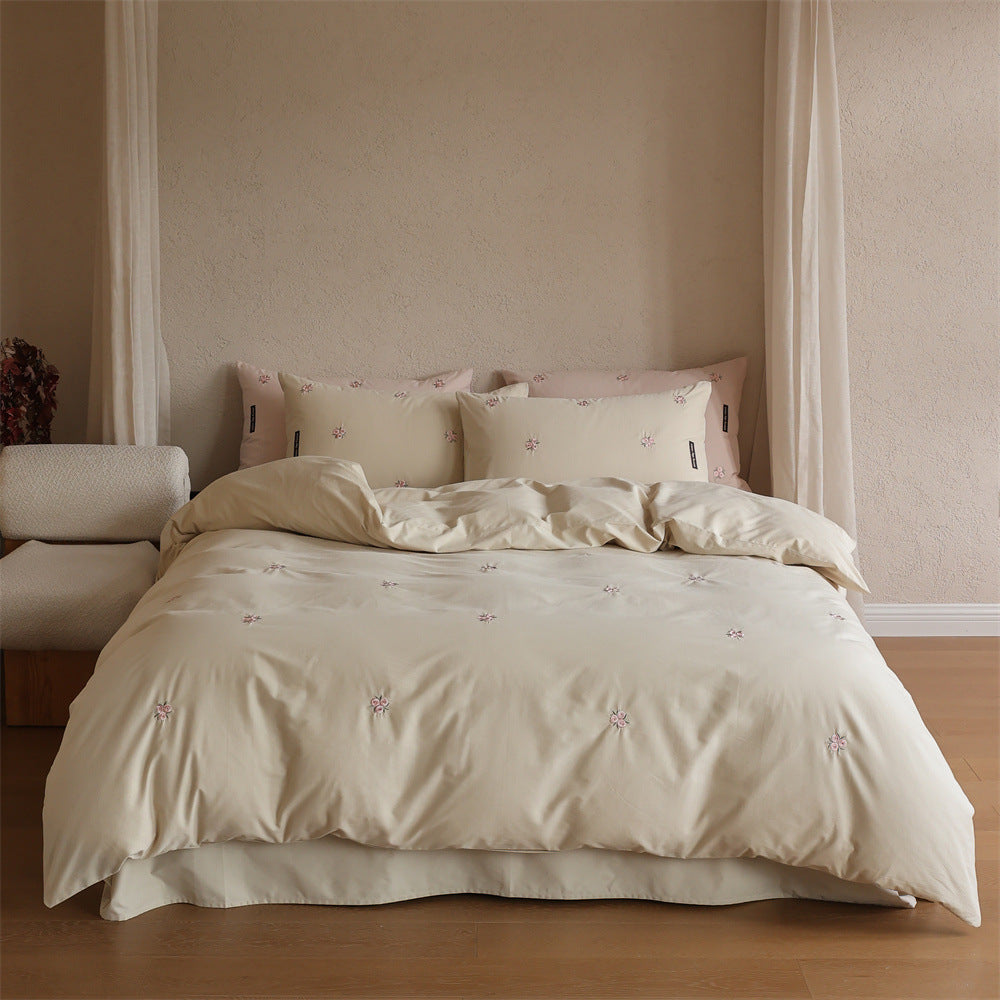 Embroidered cotton satin bedding set with subtle floral embroidery
