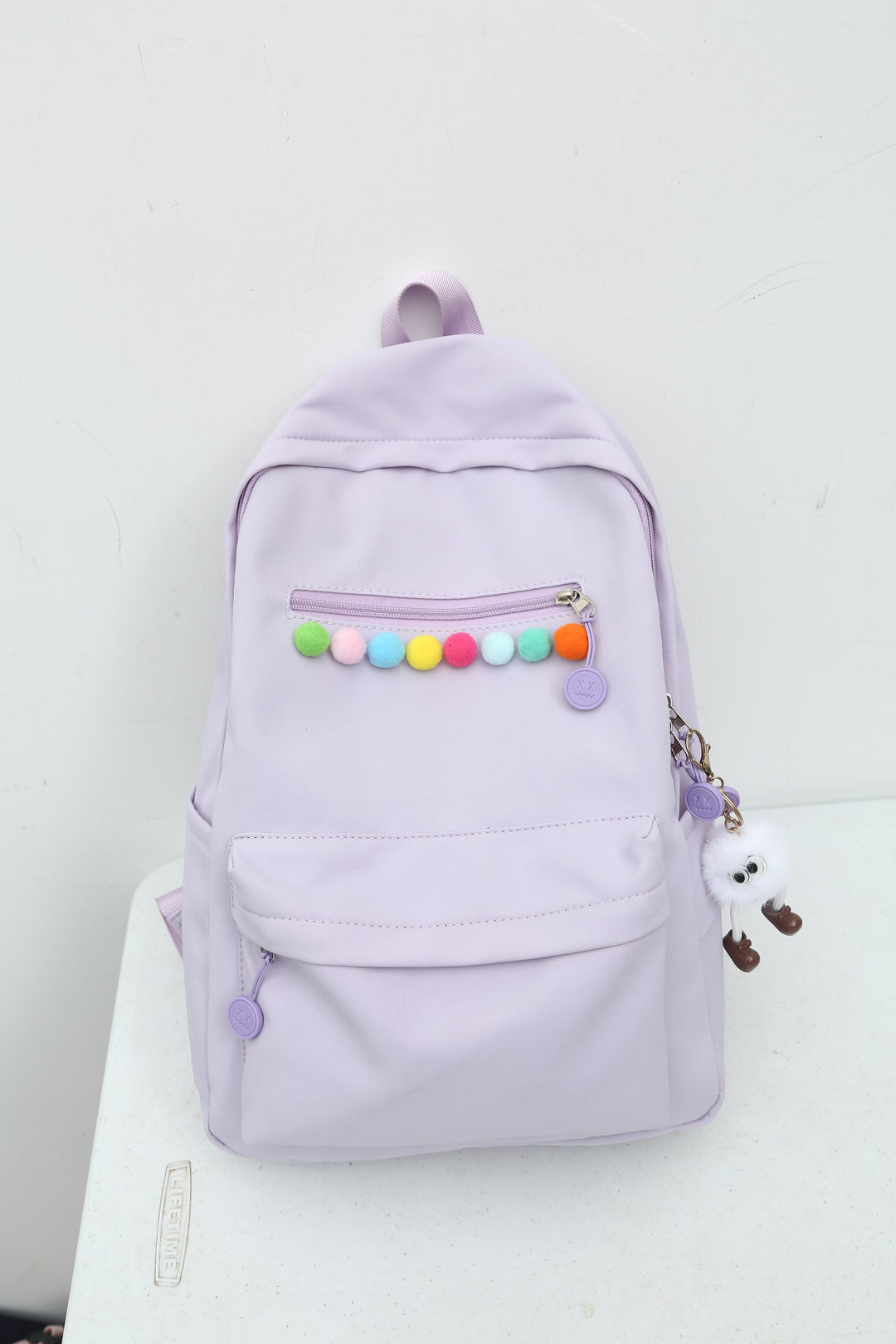 Practical backpack with colorful applications Kalsten