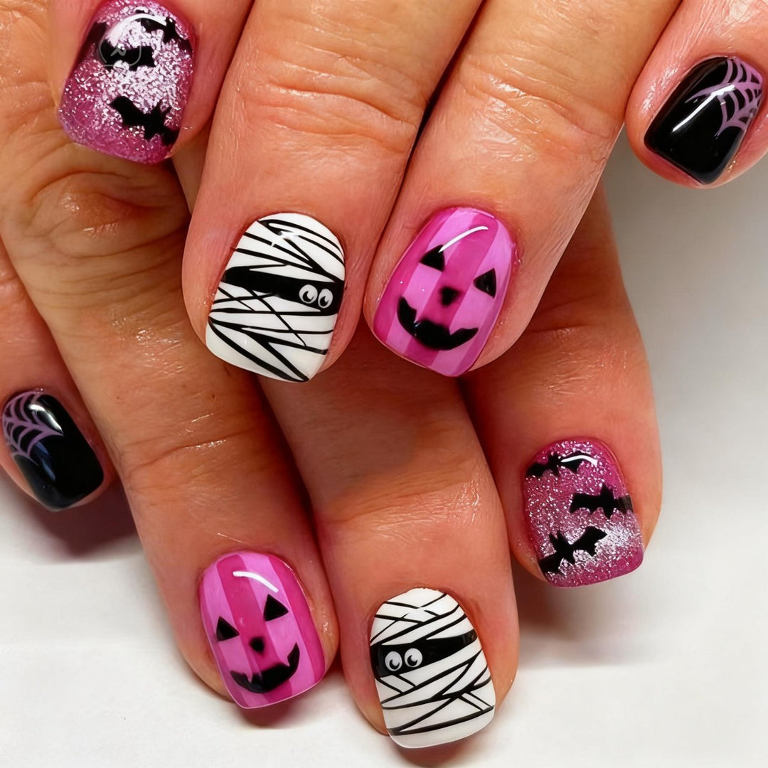 Creative nail art set with Halloween motifs and glitter accents Kalsten