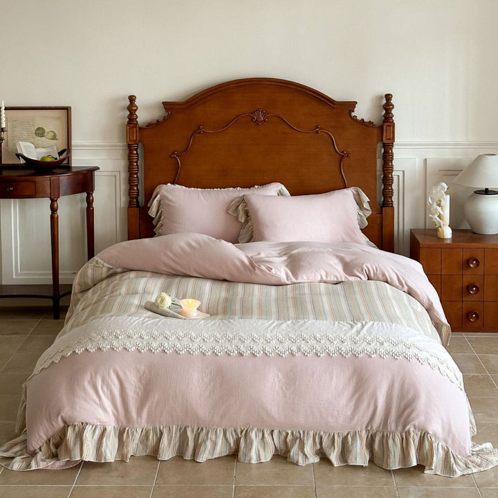 Multi-piece cotton satin bedding set with lace trim and striped ruffled bed skirt