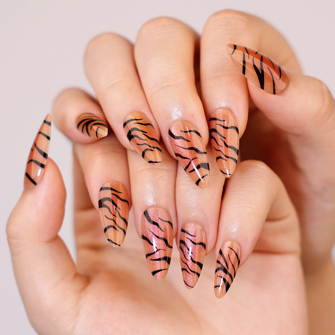 Artful stiletto nails with creative tiger stripe design Kalsten