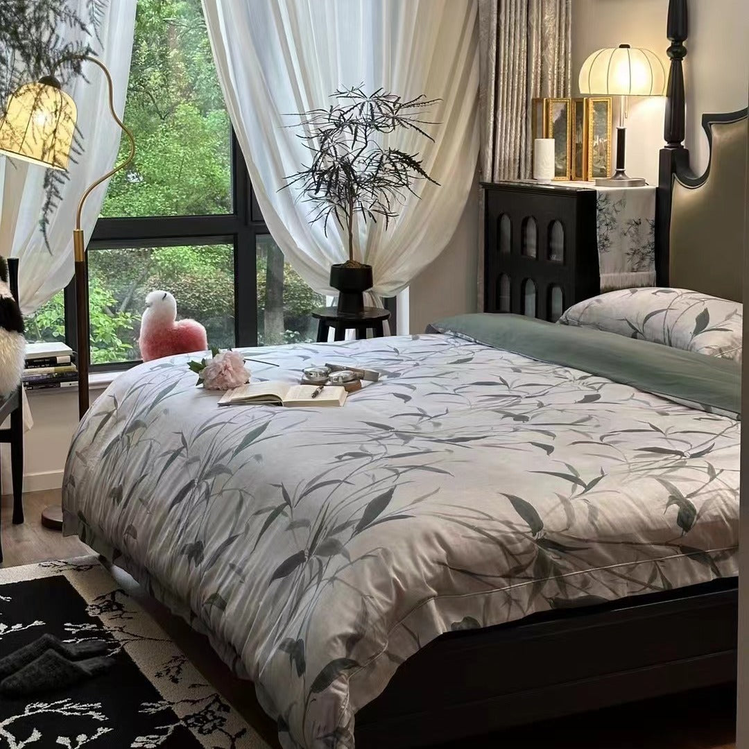 Bedding set made of cotton satin with botanical bamboo leaf print and reversible pillowcases