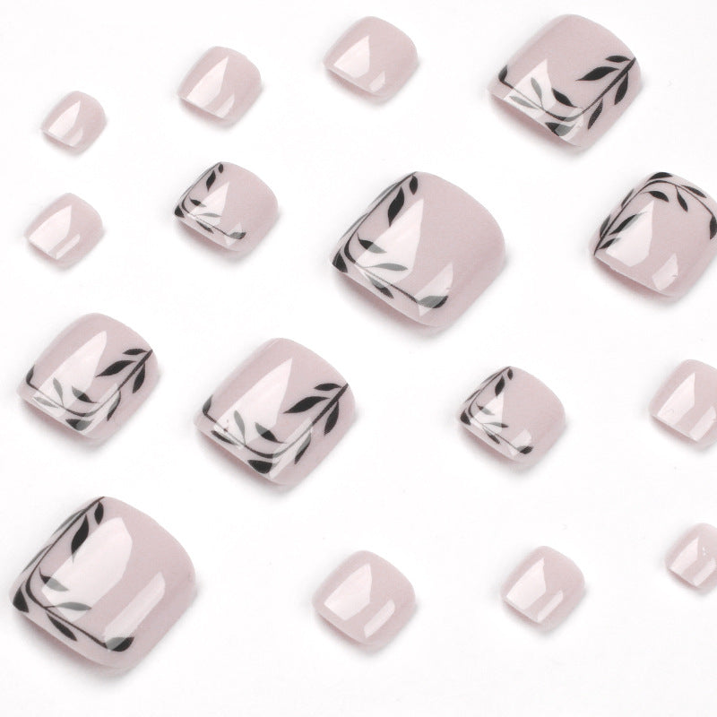 Artful toenail art with delicate leaf motifs Kalsten