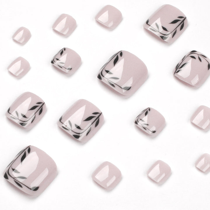 Artful toenail art with delicate leaf motifs Kalsten
