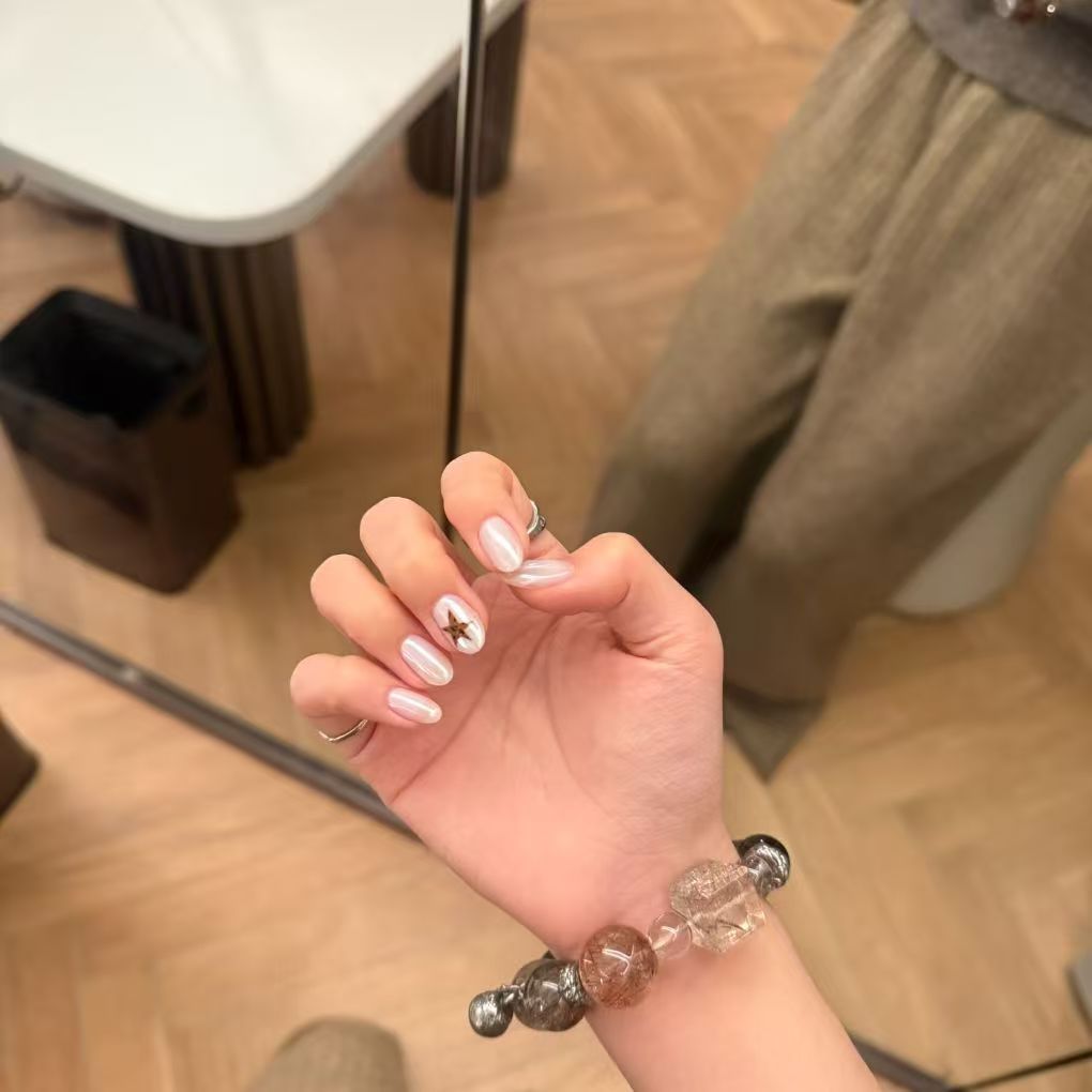 Elegant Nail Art Extensions with Star Accents