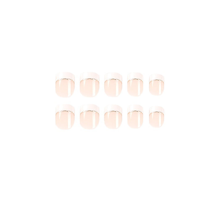 Artful nail extensions with elegant French tip and gold accents Kalsten