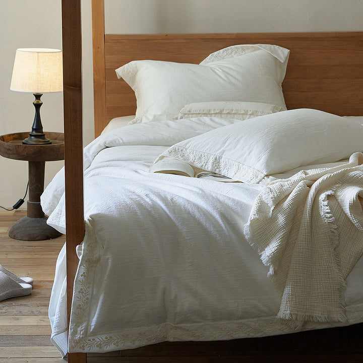 Cotton gauze bedding set with fine tone-on-tone floral embroidery and ruffle