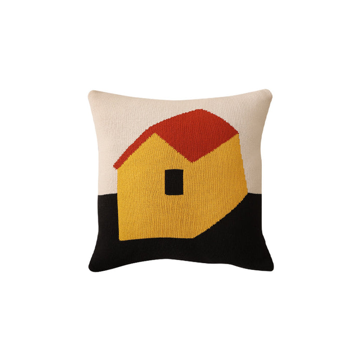 Geometric knit pillow with triangle pattern and logo patch