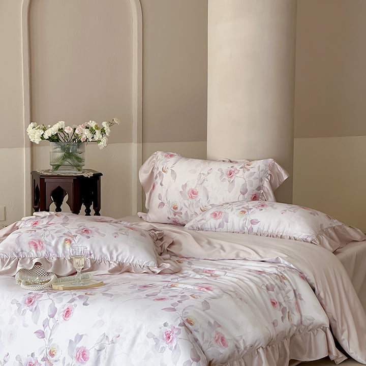 Luxurious satin bedding set with ruffled pillows and delicate watercolor rose print