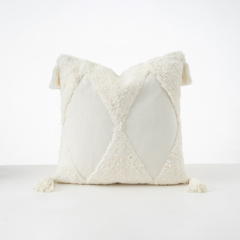 Square cushions with structured boucle look, quilted tufting and decorative tassels