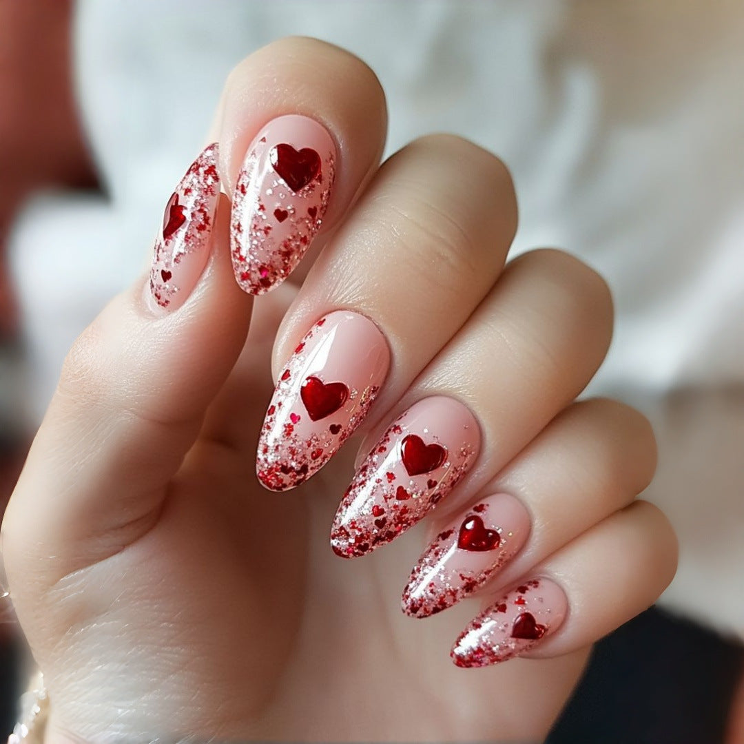 Artificial nails with sparkling heart design and glitter coating Kalsten