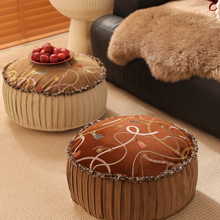 Beef seat pouf with embroidered top, pleated side panel and decorative fringe edge