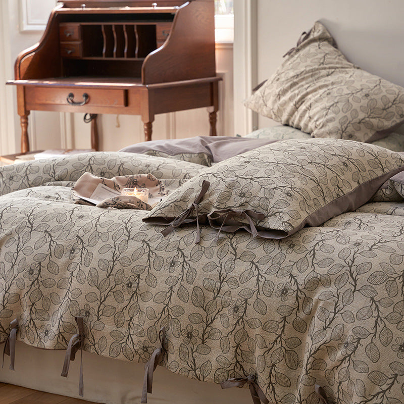 Bedding set made of cotton percale with fine floral woven texture and decorative bows