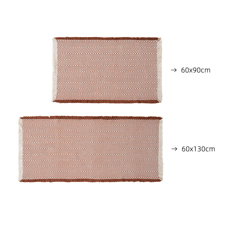 Handwoven cotton bath mat with herringbone pattern and fringes Kalsten