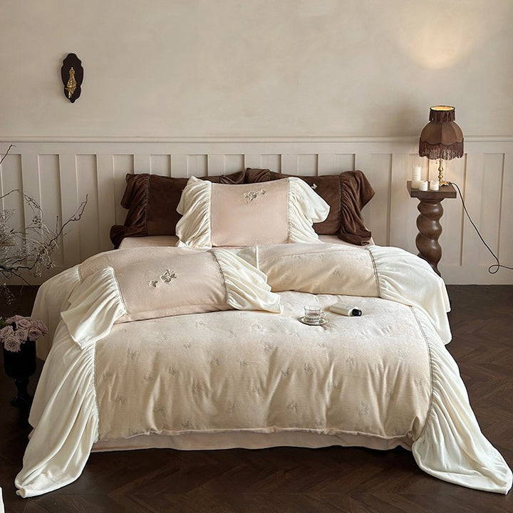 Satin bedding set with gathered ruffles and delicate butterfly embroidery