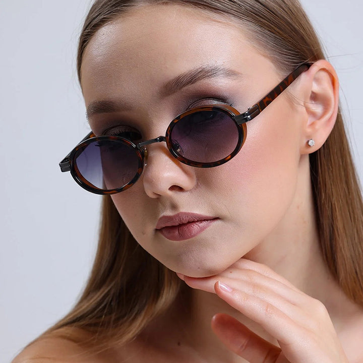 Women's round sunglasses with lightweight lenses and gold accents Kalsten