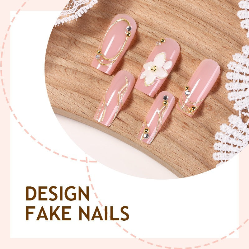 Elegant artificial nail set with decorative flower and gold embellishments Kalsten