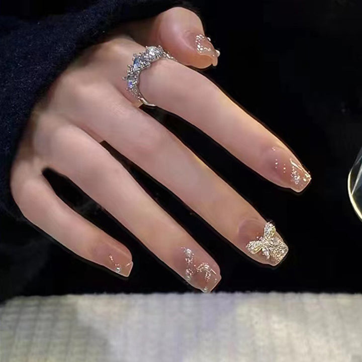 Artificial nails in an elegant design with 3D butterflies and glitter accents Kalsten