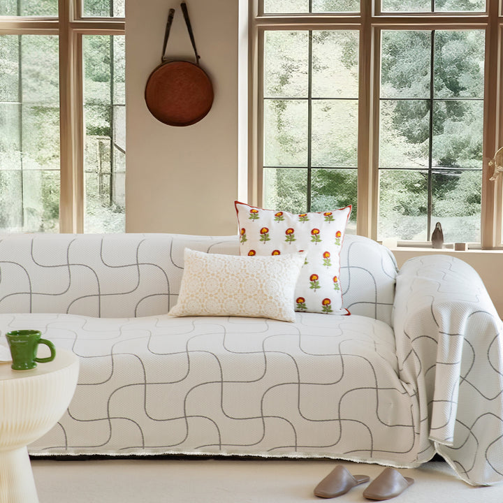 Woven sofa throw made of cotton blend with geometric pattern
