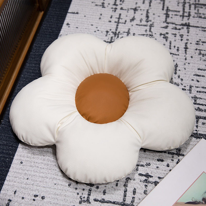 Padded seat cushion in flower shape with faux leather center piece and fluffy edge padding