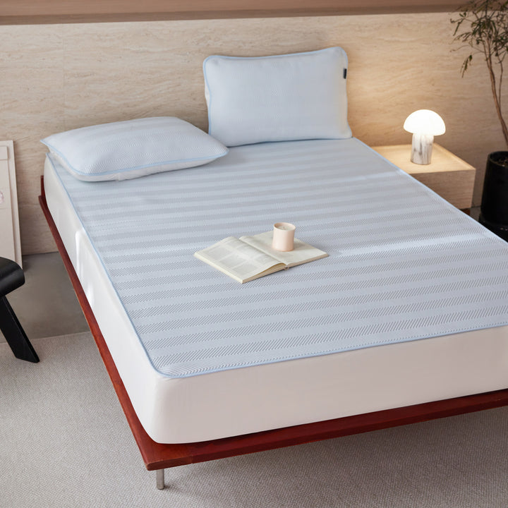 Breathable mattress topper with non-slip bottom and moisture-regulating structure