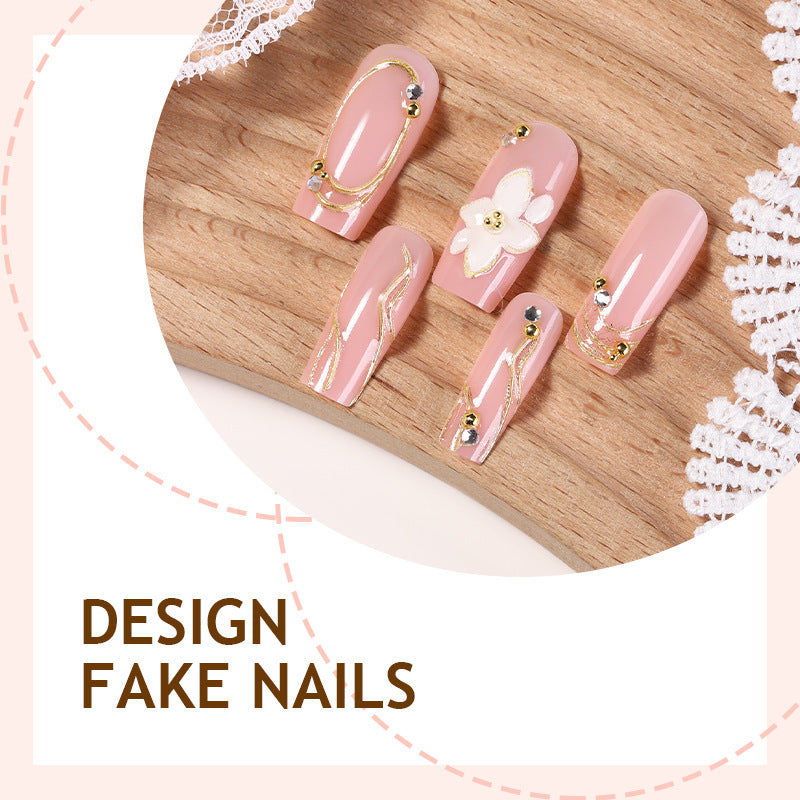 Artificial nail set with floral embellishments and gold accents Kalsten