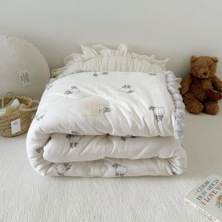 Cuddle blanket baby quilt with plush lining and bunny motif