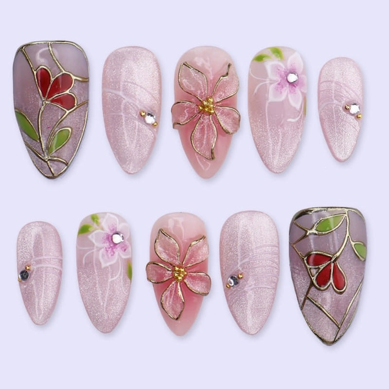 Artificial nail set with luxurious floral designs and glitter accents Kalsten