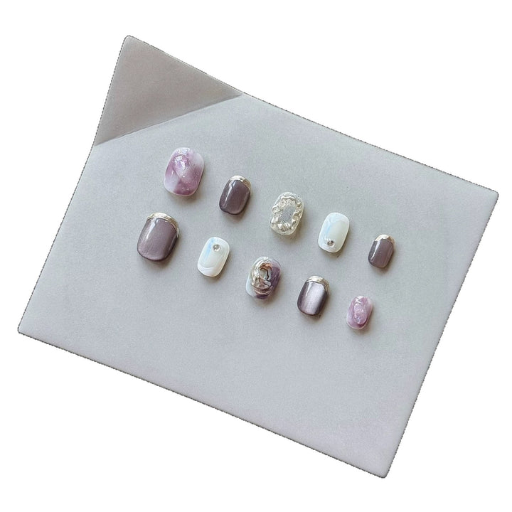 Artistic Press-On Nail Art Set with Unique Ombre and Metallic Accents