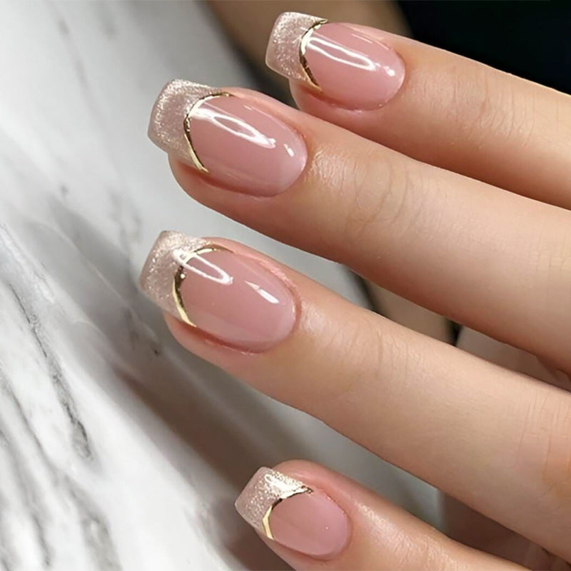 Artificial nail set with elegant glitter French tips and golden embellishments Kalsten