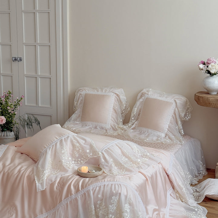 Satin bed linen set with embroidered chiffon ruffle and quilted bedspread