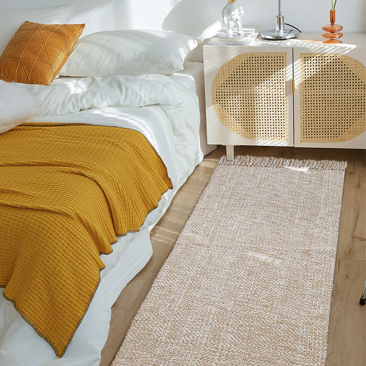 Woven table runner made of cotton blend with fine structure and herringbone look as well as decorative fringes Kalsten