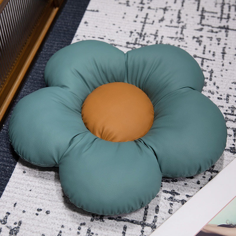 Padded seat cushion in flower shape with faux leather center piece and fluffy edge padding