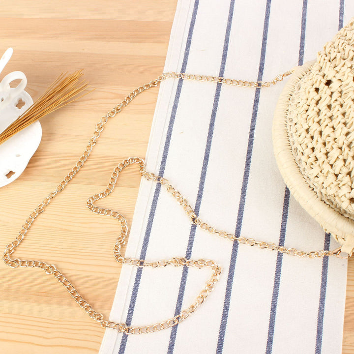 Shoulder bag made from handcrafted natural fibers with elegant chain decoration Kalsten