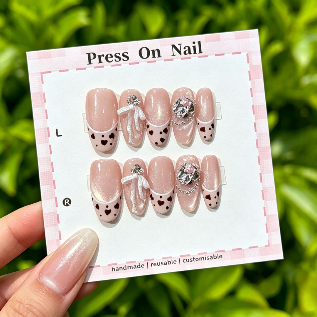 Artistic Press-On Nail Art Set with Cute Character and Bow Accents