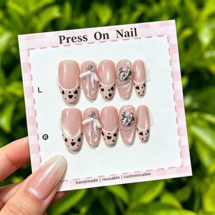 Artistic Press-On Nail Art Set with Cute Character and Bow Accents